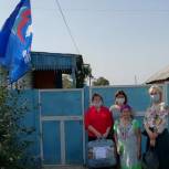 В Кизильском районе партийцы  вручили подарок  Екатерине Тургунбаевой