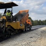Завершают устройство асфальта на объездной автодороге в Каменке